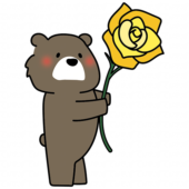 黄色い大きなバラを持っているクマ