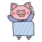 布団で寝ているぶた