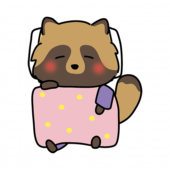 布団で寝ているタヌキ