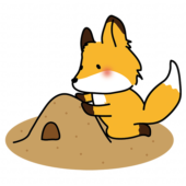 砂場で砂遊びをするキツネ