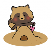 砂場で砂遊びをするタヌキ