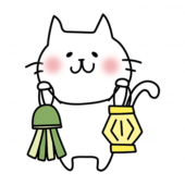 七夕飾りを持っている白い猫