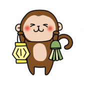 七夕飾りを持っている猿