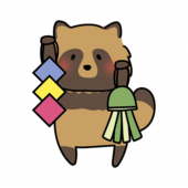 七夕飾りを持っているタヌキ