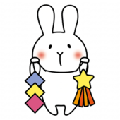 七夕飾りを持っている白いうさぎ