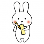 短冊に七夕の願い事を書く白いうさぎ