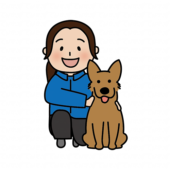 一緒に座っている女性ドッグトレーナーと立ち耳わんちゃん