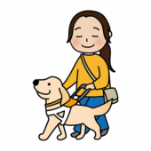 たれ耳の盲導犬と歩く女性