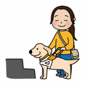 段差の前で立ち止まるたれ耳の盲導犬