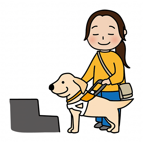 段差の前で立ち止まるたれ耳の盲導犬