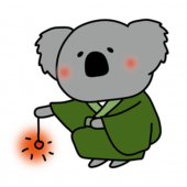 緑の浴衣を着て線香花火をするコアラ