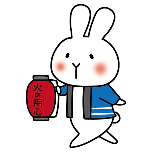 火の用心の提灯を持って声掛けをしている白いうさぎ
