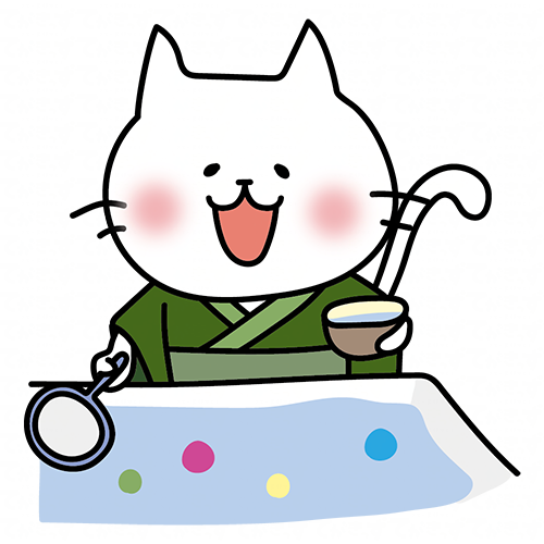 緑の浴衣を着てボールすくいをする白い猫