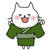 緑の浴衣を着ている白い猫