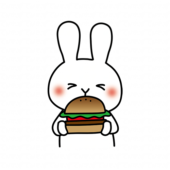 大きなハンバーガーを食べる白いうさぎ