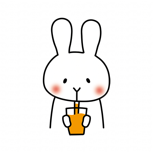 オレンジジュースを飲む白いうさぎ