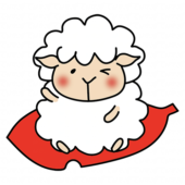 大きな落ち葉に乗る羊