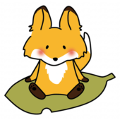 大きな落ち葉に乗るキツネ