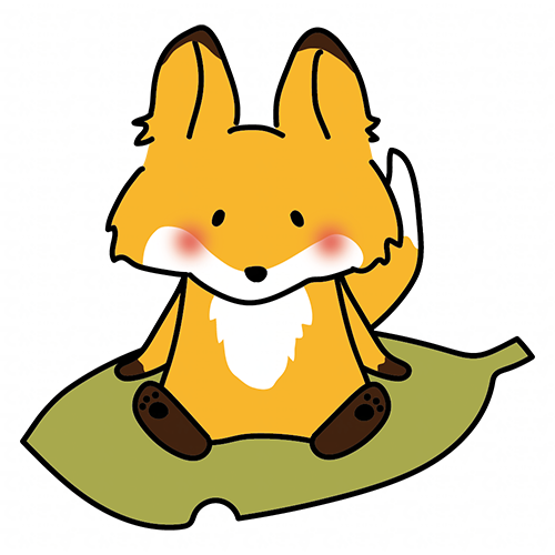 大きな落ち葉に乗るキツネ