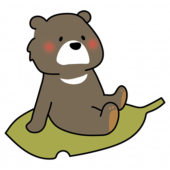 大きな落ち葉に乗るクマ