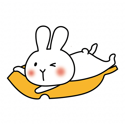 大きな落ち葉に乗る白いうさぎ