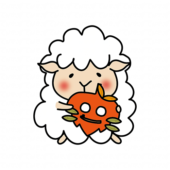 落ち葉のお面を持つ羊