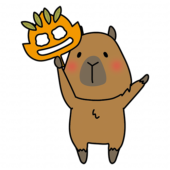 落ち葉のお面を持つカピバラ