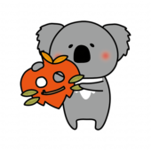 落ち葉のお面を持つコアラ