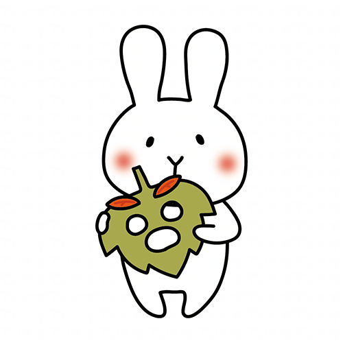 落ち葉のお面を持つ白いうさぎ